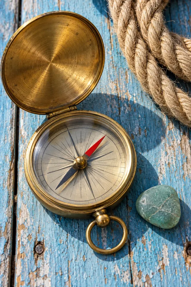 Brass Compass and Nautical Rope