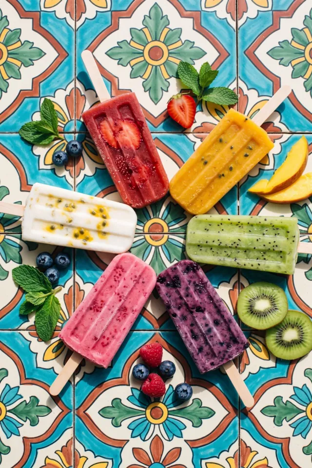 Fruit Popsicles on Patterned Tiles