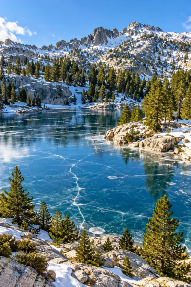 Clear Ice on a Sunlit Mountain Lake