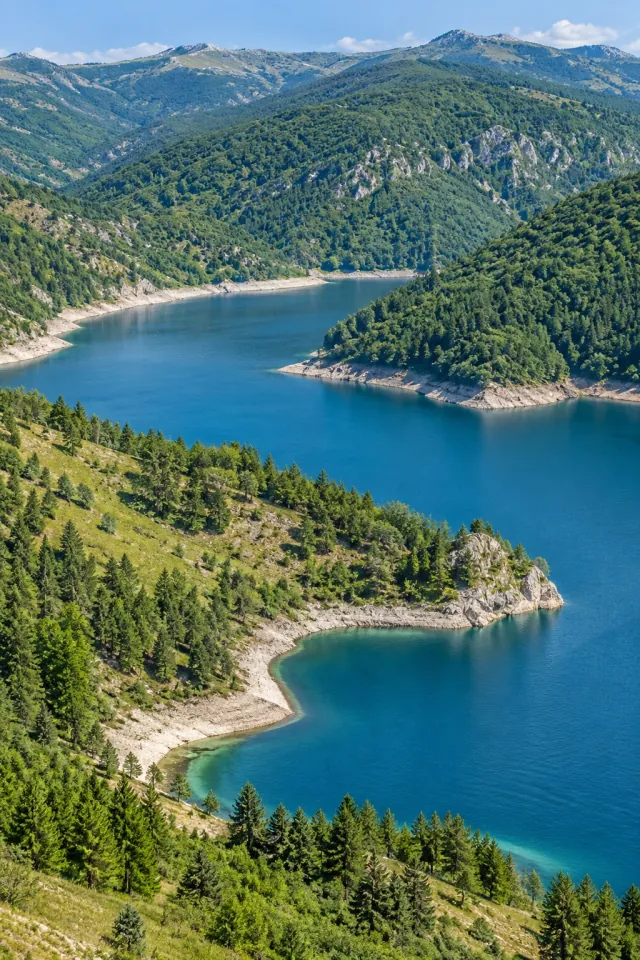 Winding Lake among Green Ridges