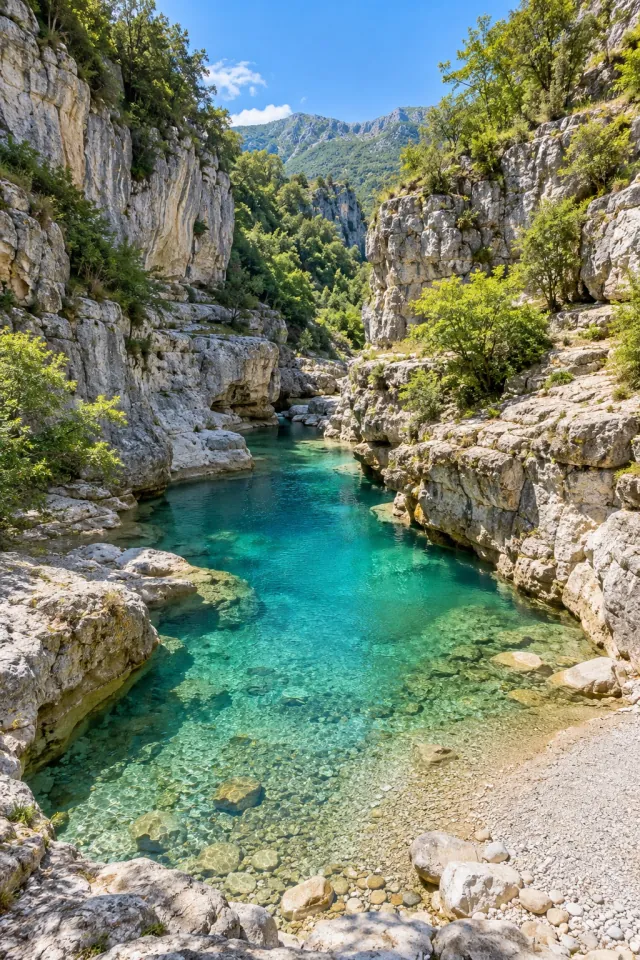 Clear Pool in a Sunlit Mountain Gorge