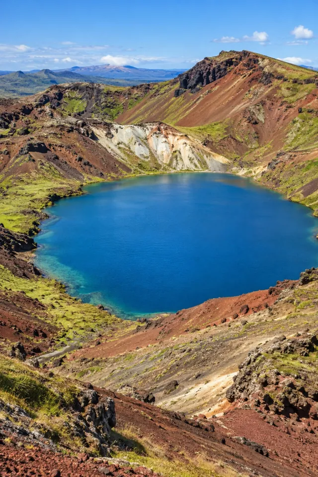 Red Volcanic Slopes and a Blue Lake